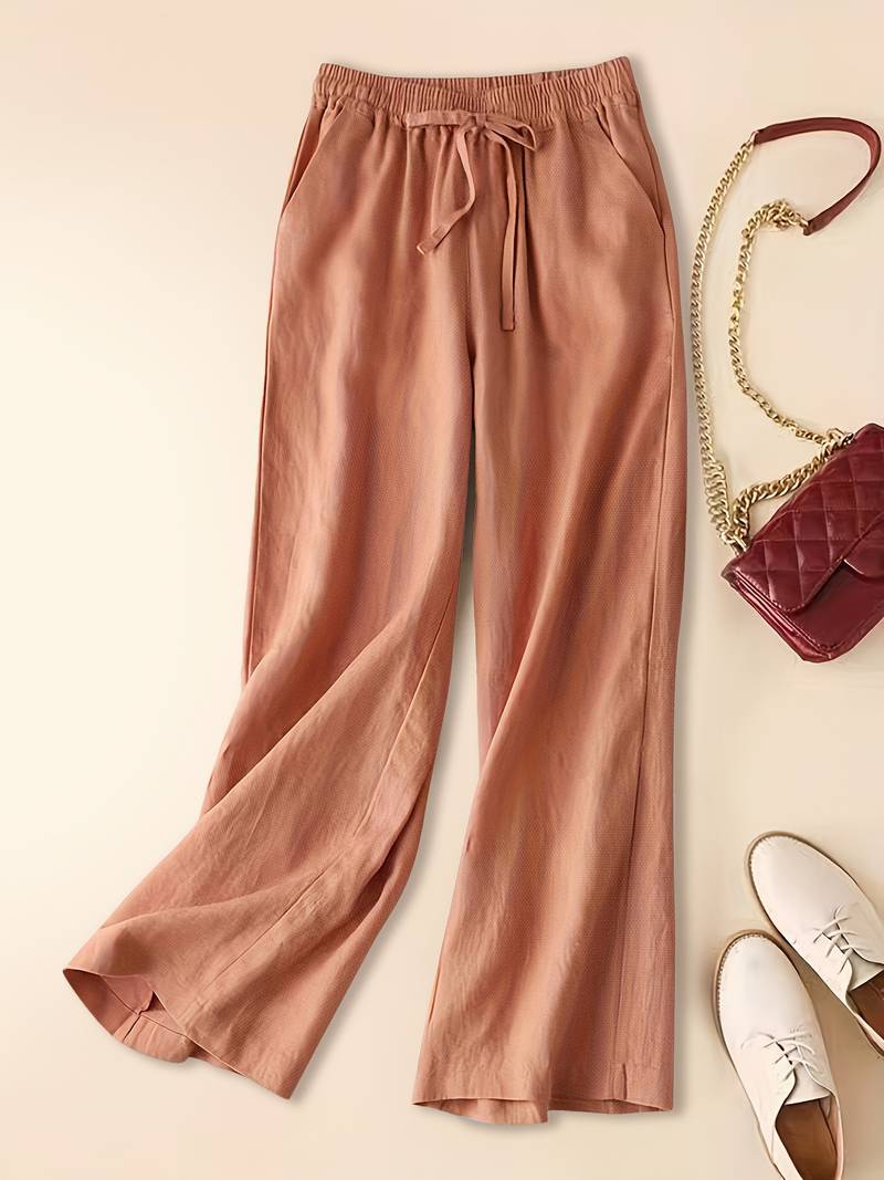 Imara wide-leg drawstring trousers in salmon, flat front view