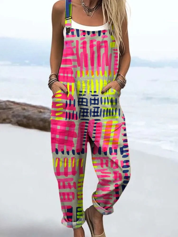 Multicoloured brushstroke print dungarees worn with white vest top, full-length front view
