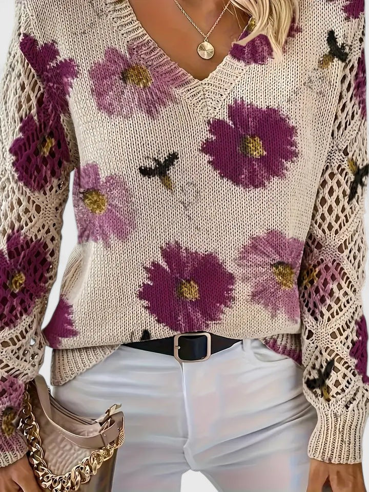 Close-up of Tahlia sweater V-neckline and crochet sleeve panels in purple