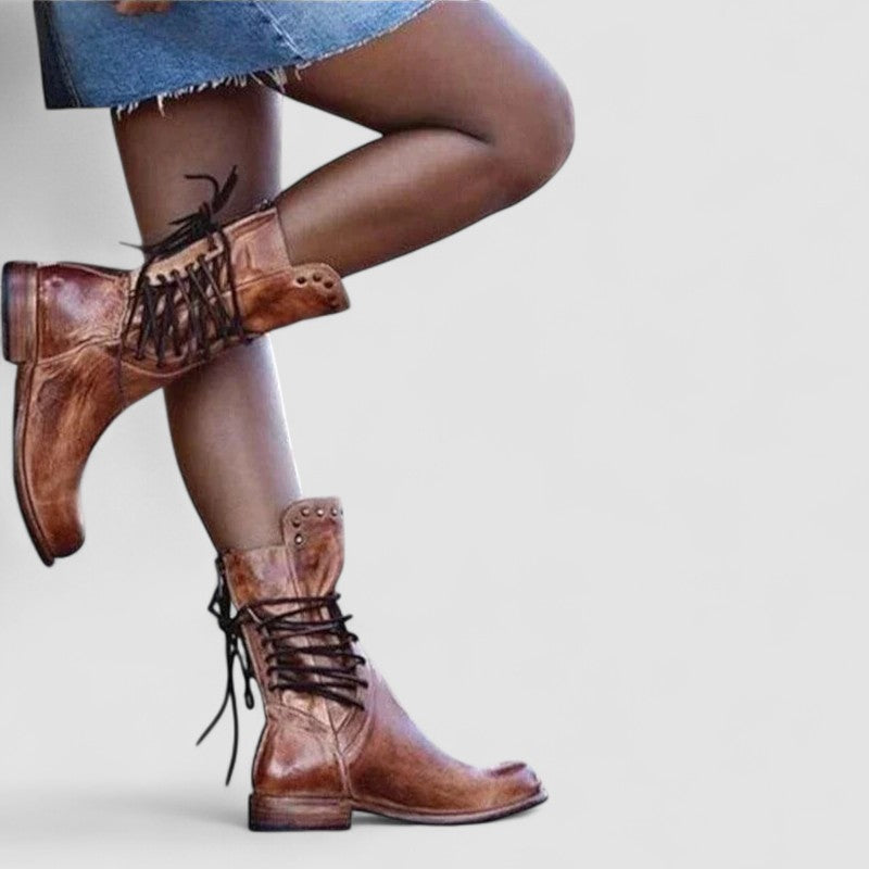 Rachel vintage lace-up ankle boots in brown, styled with a short skirt