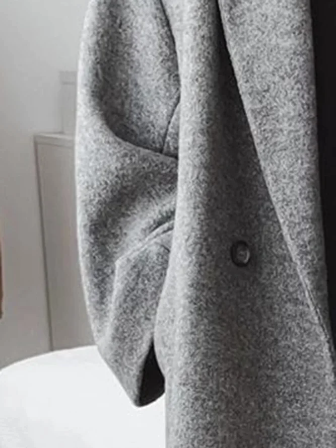 Daphira coat in grey, close-up of wool-blend texture and front fastening