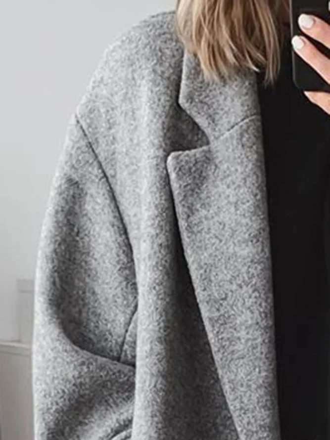 Daphira coat in grey, close-up of lapel and shoulder