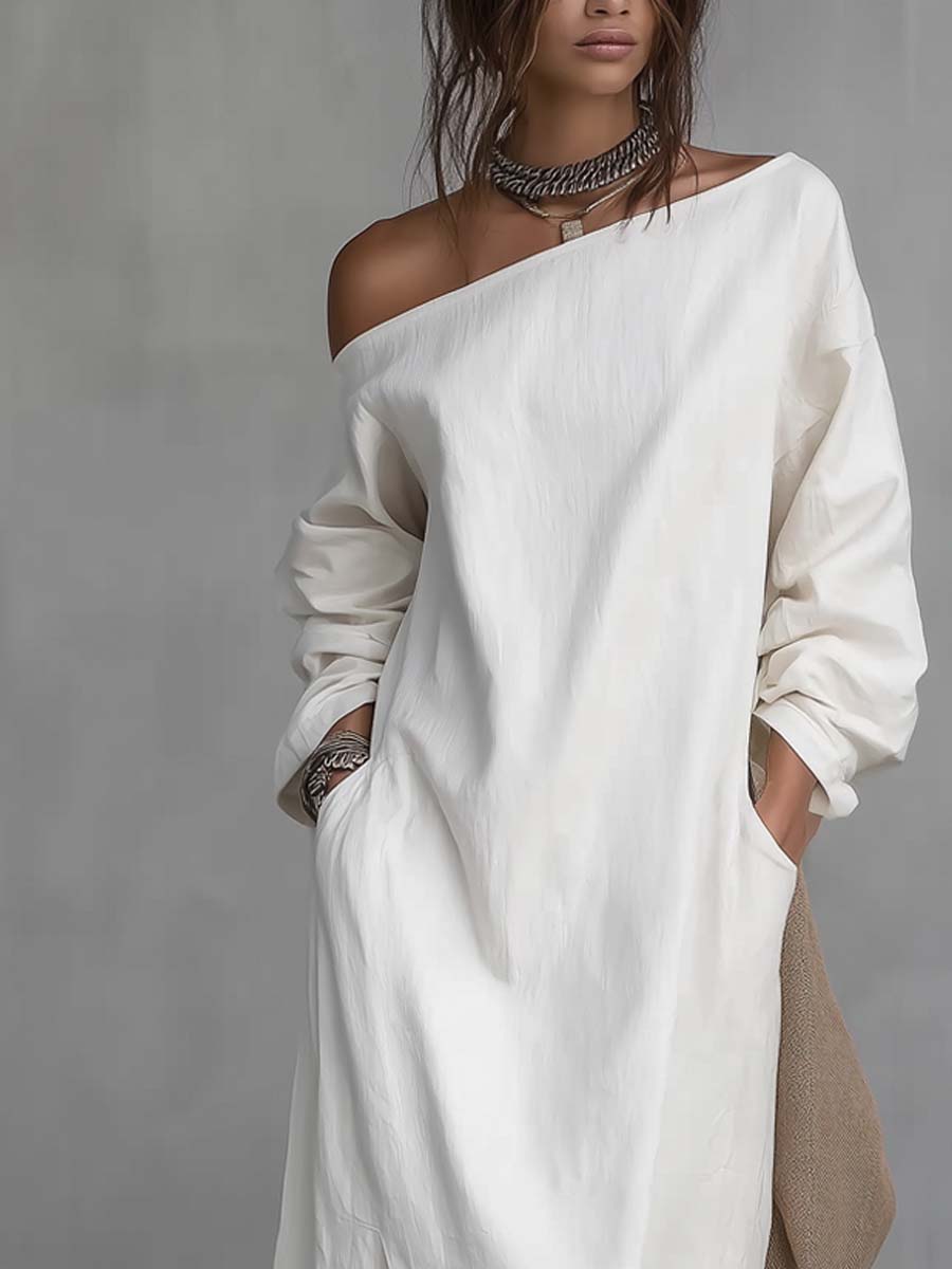 One shoulder midi dress in white, close-up of asymmetric neckline