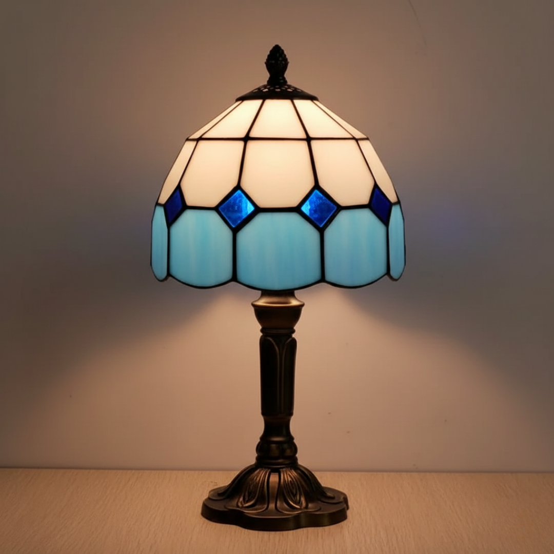 Cloudy Thoughts stained-glass table lamp in cream and blue, lit front view