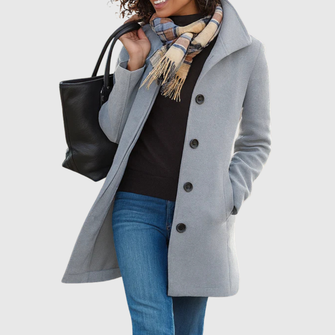 Connie classic coat in light grey, worn open over jeans, front view