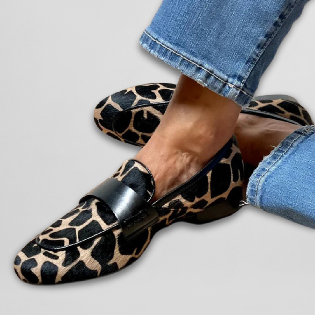 Katherine animal-print loafers, close side view showing black saddle strap