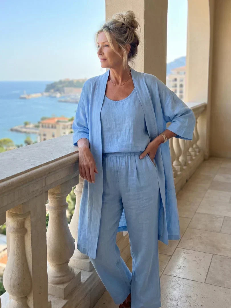 Lorrin three-piece set in light blue worn on a sunny balcony