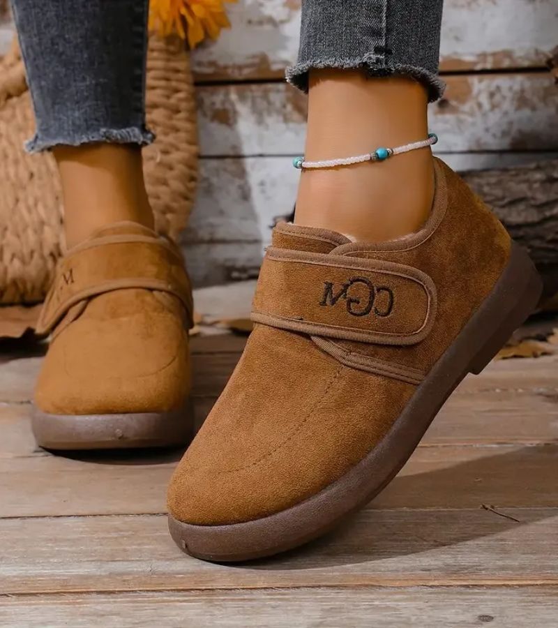 Doralise strap shoes in brown, worn with jeans outdoors