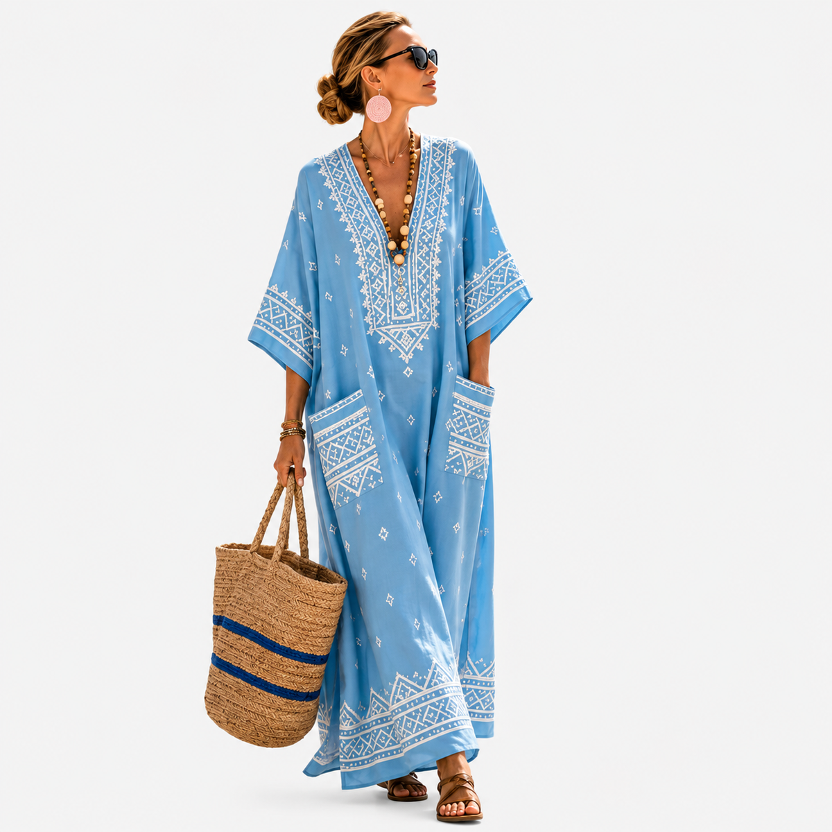 Long kaftan in sky blue with white Aztec pattern, full-length front view