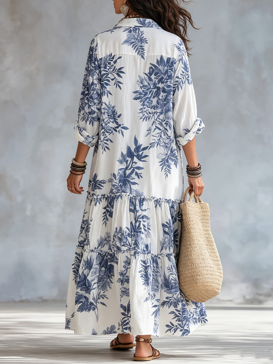 Blue floral tiered maxi dress in white, back view