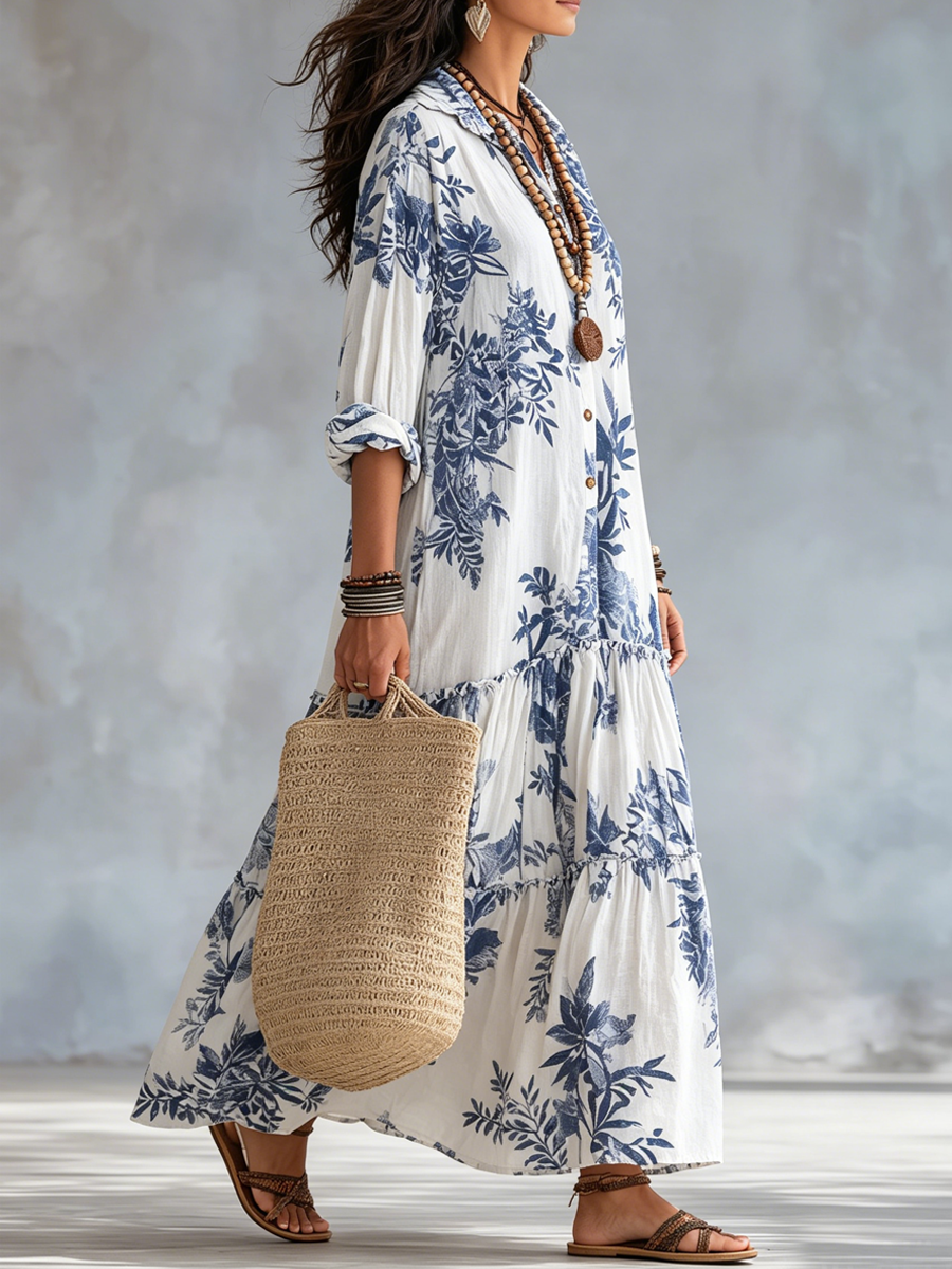 Blue floral maxi dress in white, side view showing tiered skirt