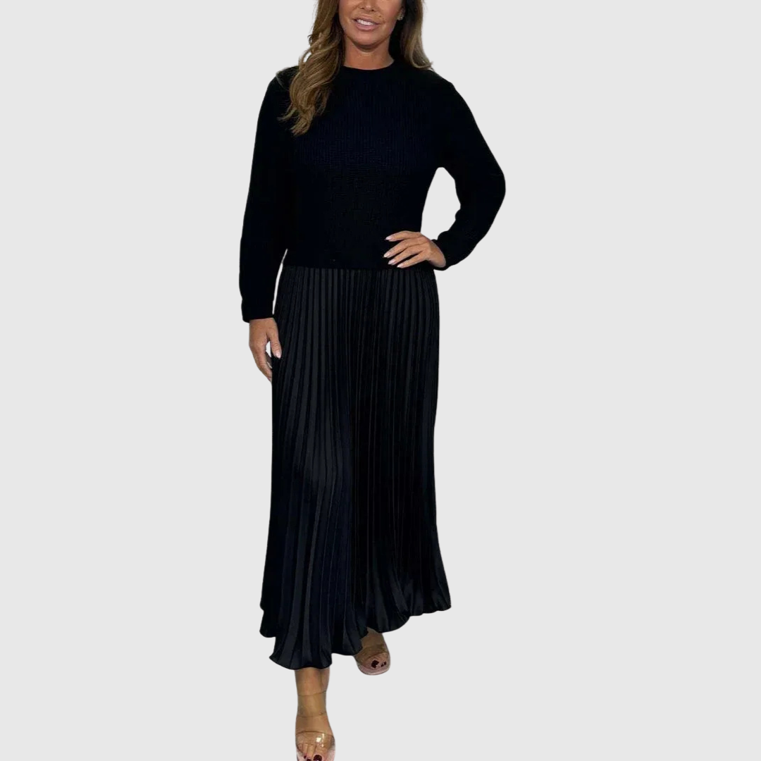 Alarice sweater and pleated skirt set in black, full-length front view