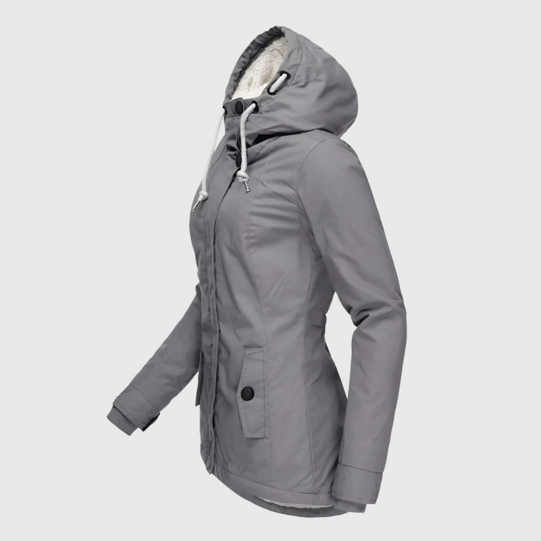 Agnes waterproof winter coat in grey, side view with buttoned pocket