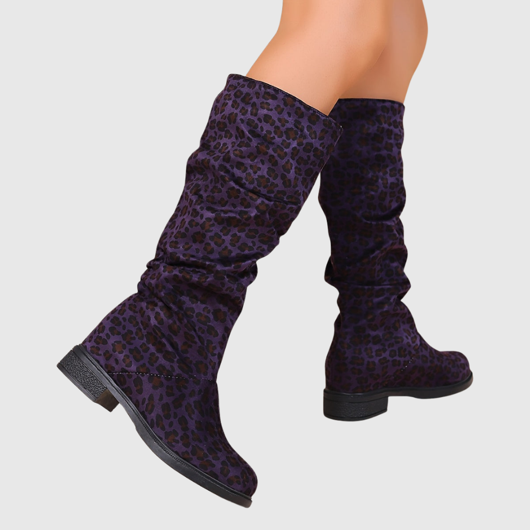 Selah leopard mid-calf boots in purple leopard print, side view on model