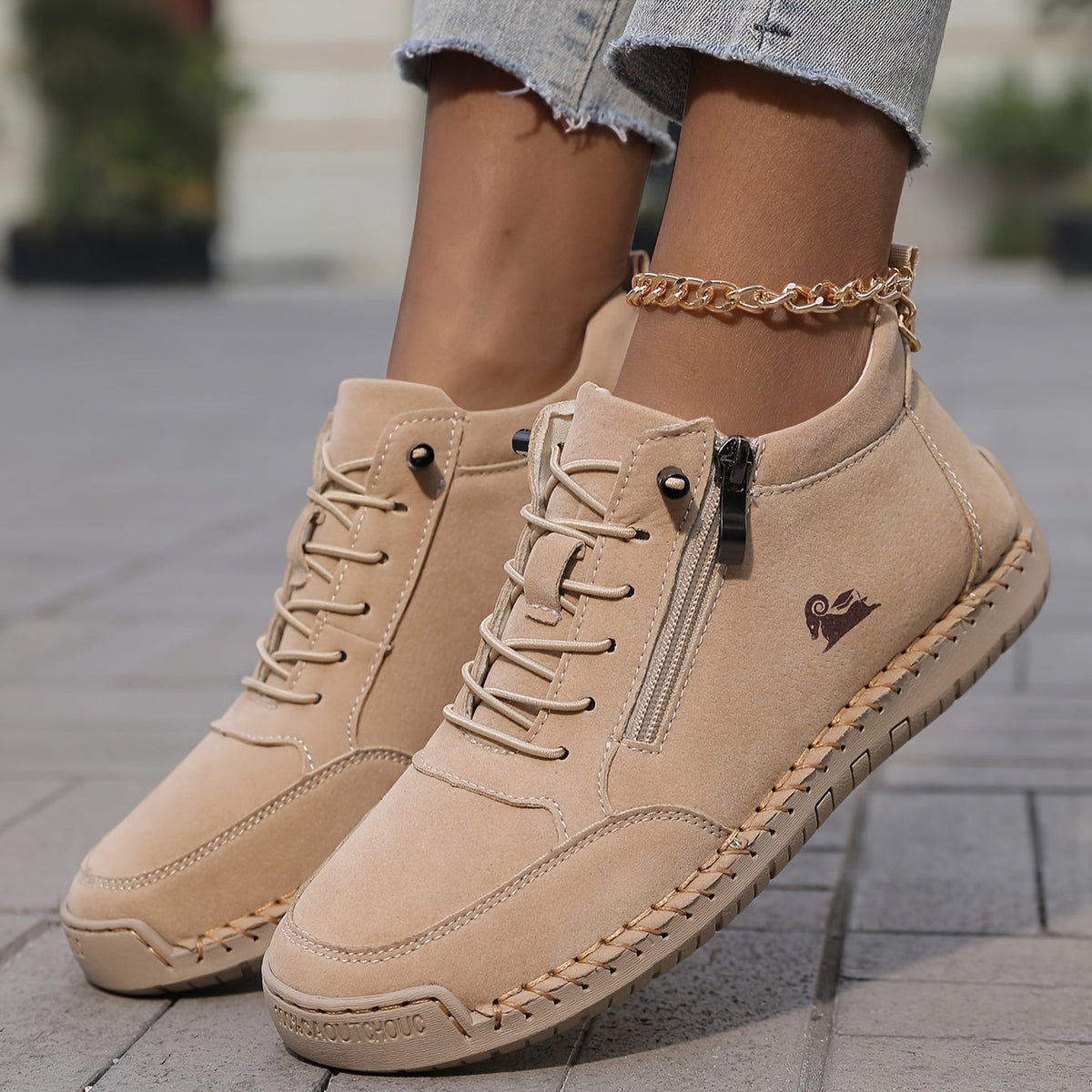Mila trainers in sand beige worn with jeans, front view