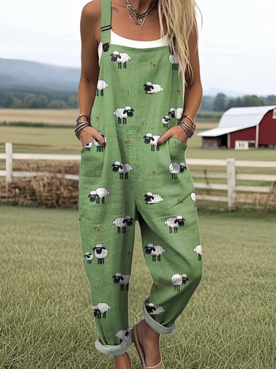 Whimsical sheep dungarees in green, full-length front view with turn-up hems