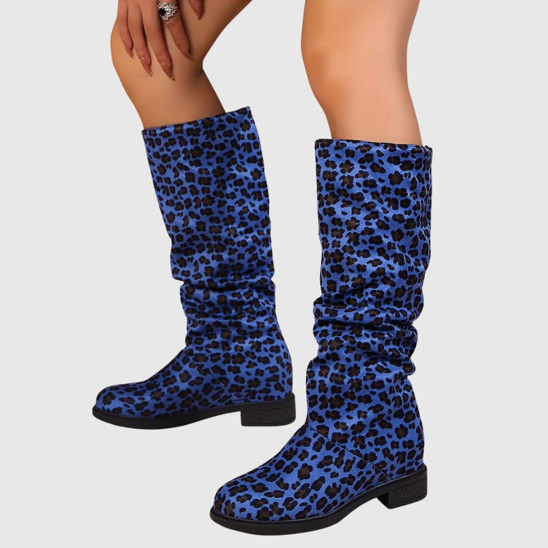 Selah leopard mid-calf boots in blue leopard print, front view on model