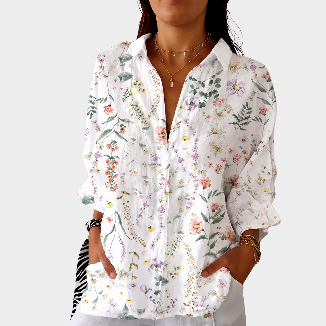 Wildflower print blouse in white, front view worn with hands in pockets