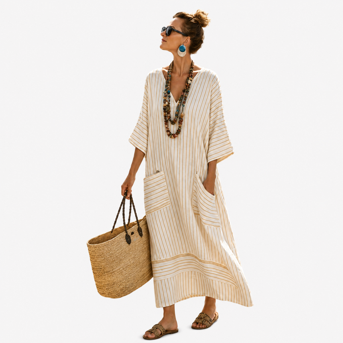 Long kaftan in white with gold vertical stripes, full-length front view with front pockets