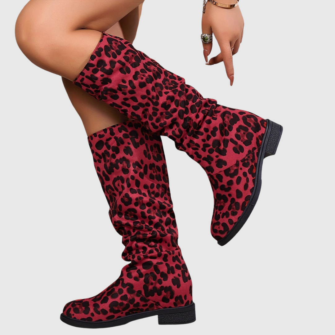 Selah leopard mid-calf boots in red leopard print, side view on model