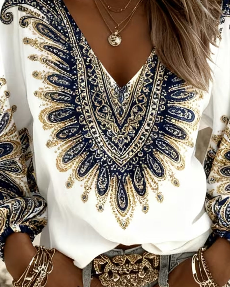Elara paisley print blouse in blue, close-up of V-neckline