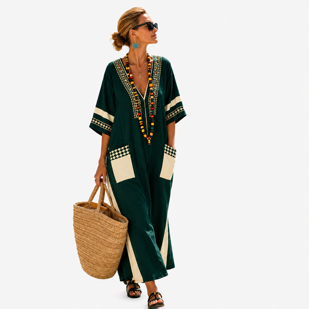 Long kaftan in dark green with cream contrast panels, full-length front view