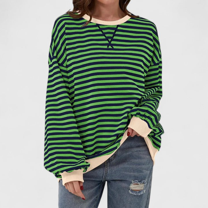Olwyn everyday striped sweater in green and navy, front view with denim