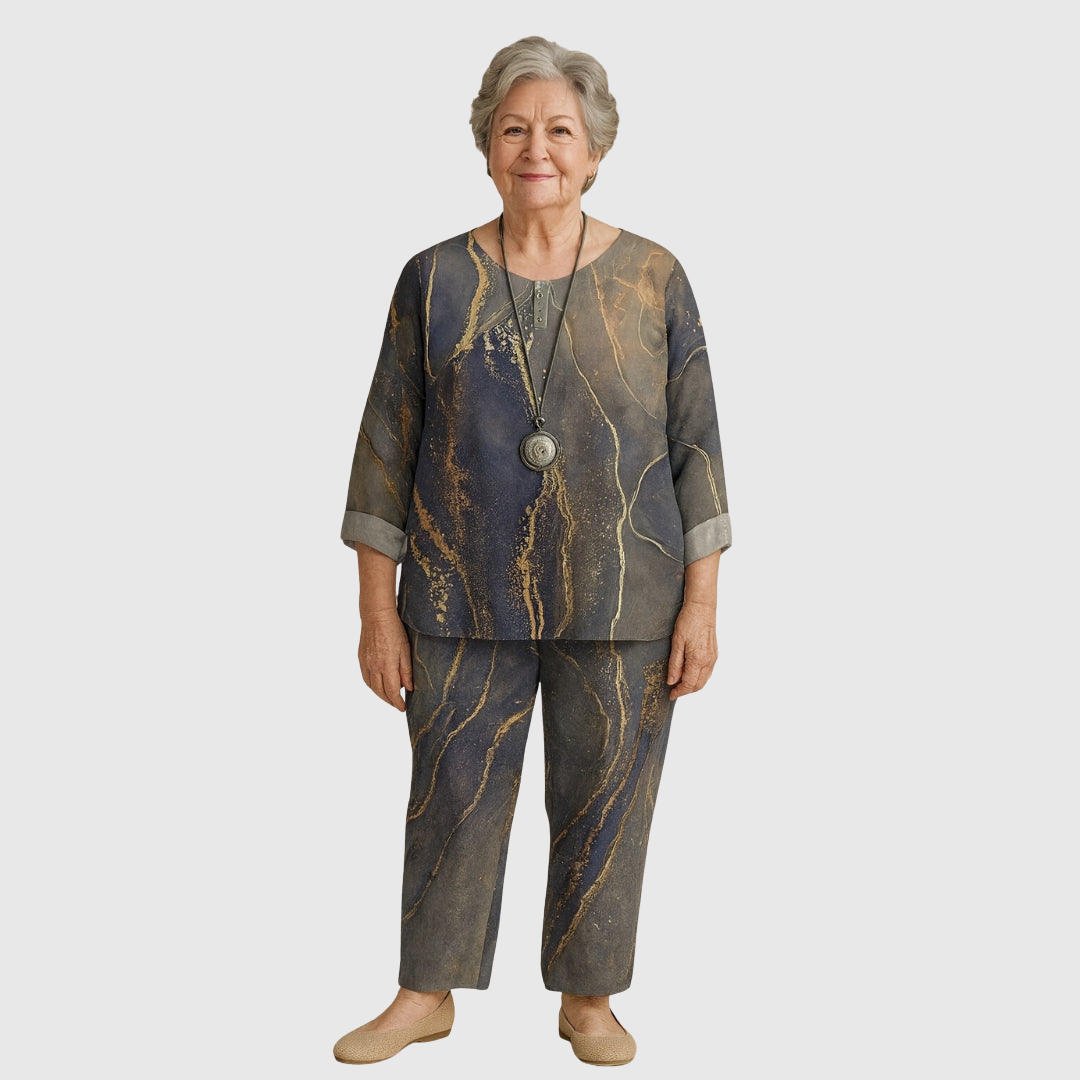 Clarisse comfort set in grey and gold marble print, worn full-length front view
