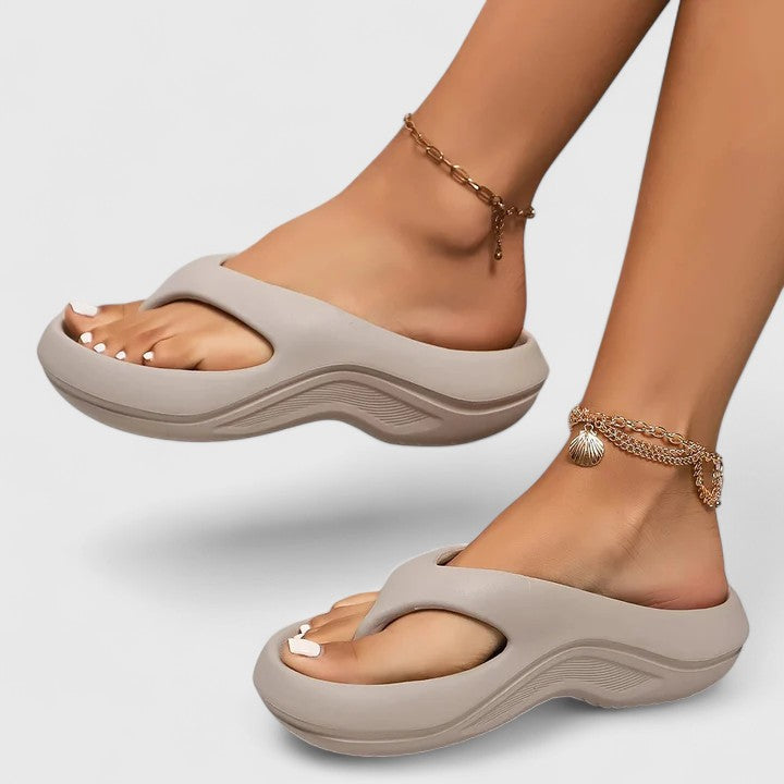 Juliette slide sandals in grey, worn front view