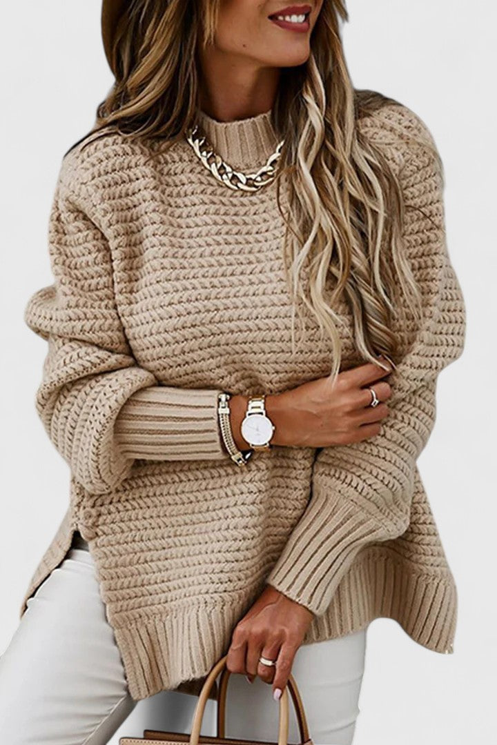 Kalyzziah chunky knit sweater in apricot, front view with chain necklace
