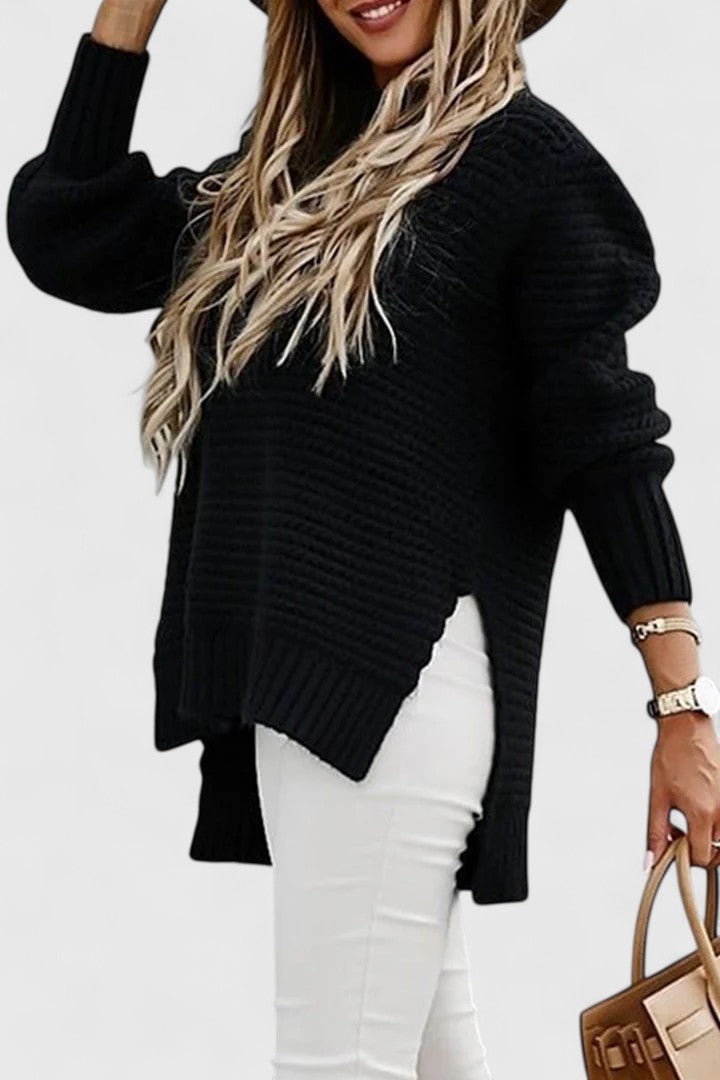 Kalyzziah chunky knit sweater in black, side view showing hem slit