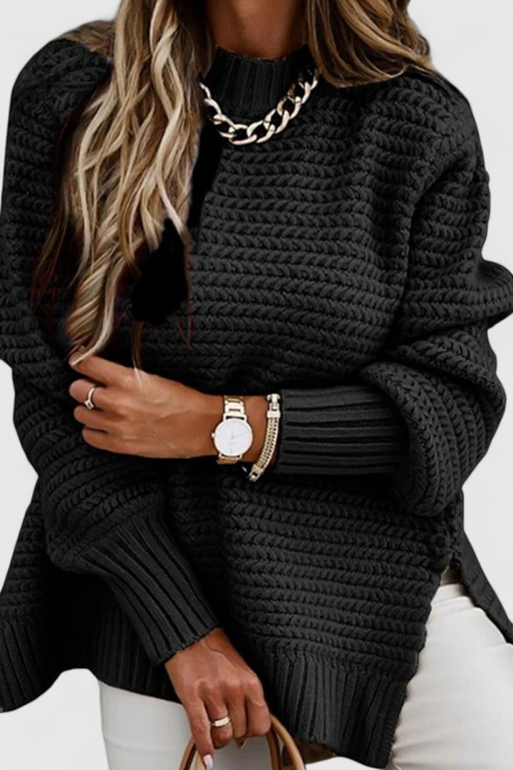 Kalyzziah chunky knit sweater in black, close-up of ribbed collar and cuffs