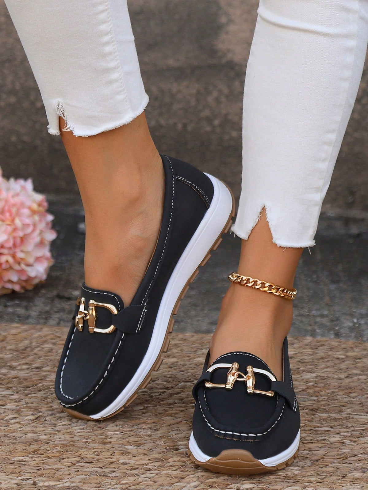 Juliet flat buckle loafers in navy, worn with white jeans