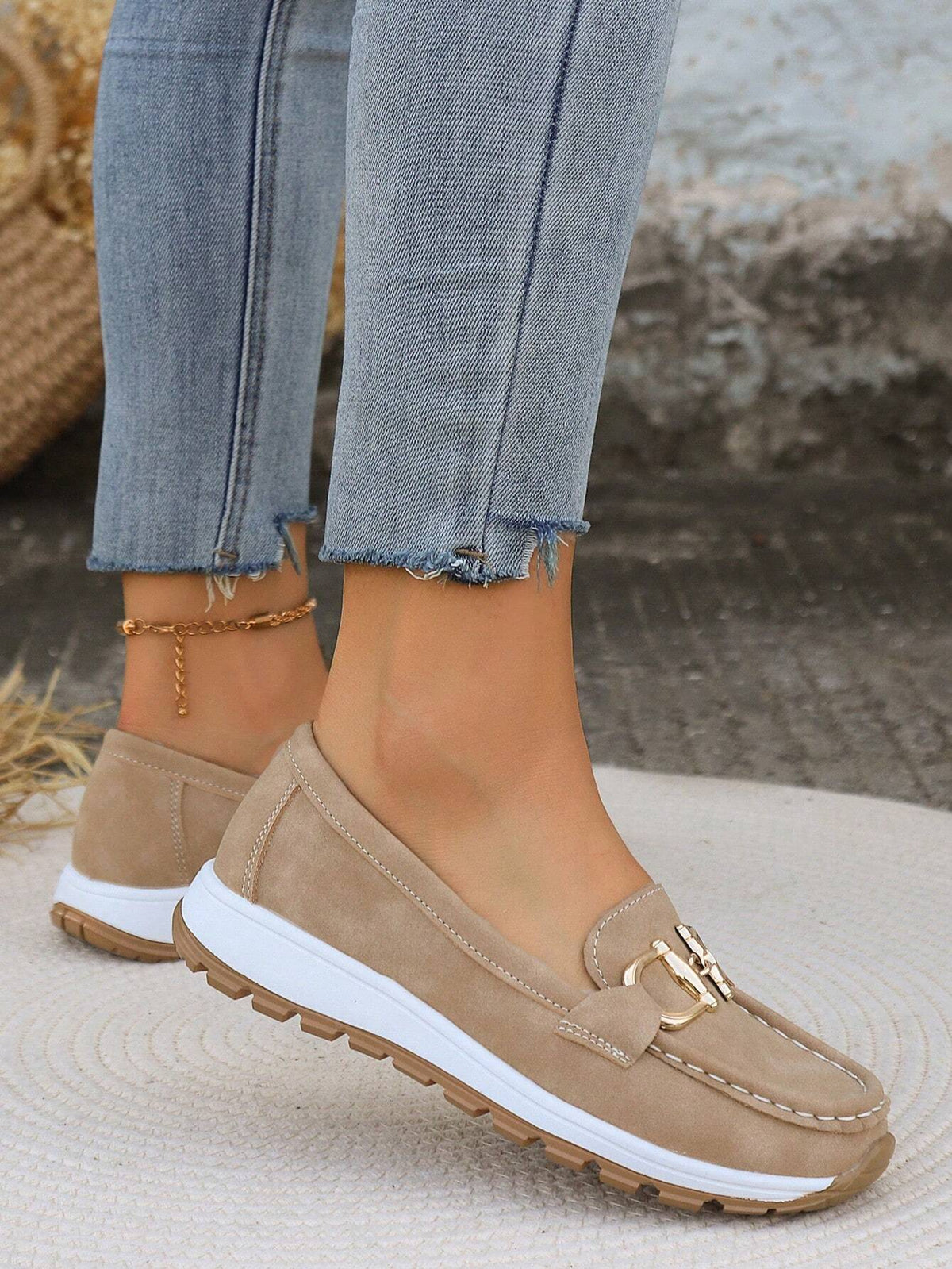 Juliet flat buckle loafers in khaki, side view on model