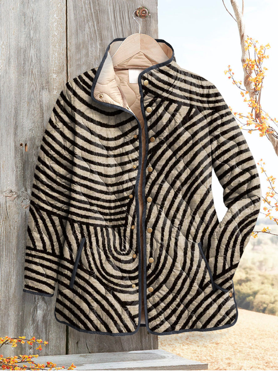 Constance padded jacket in black and cream retro circle print, front view