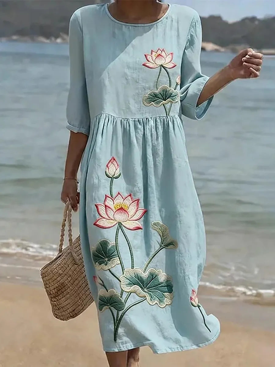Casual floral print dress in light blue with lotus flower design, full-length front view