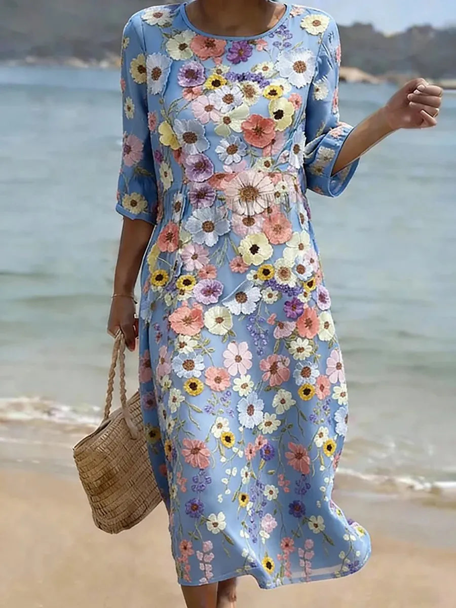 Casual floral print midi dress in blue, full-length front view on the beach