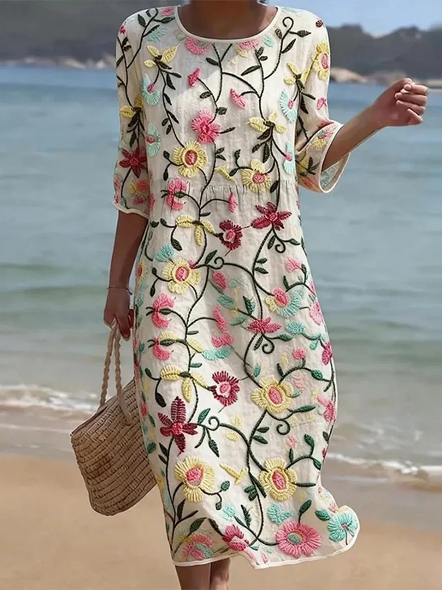 Casual floral print midi dress in cream, worn on the beach, full-length front view