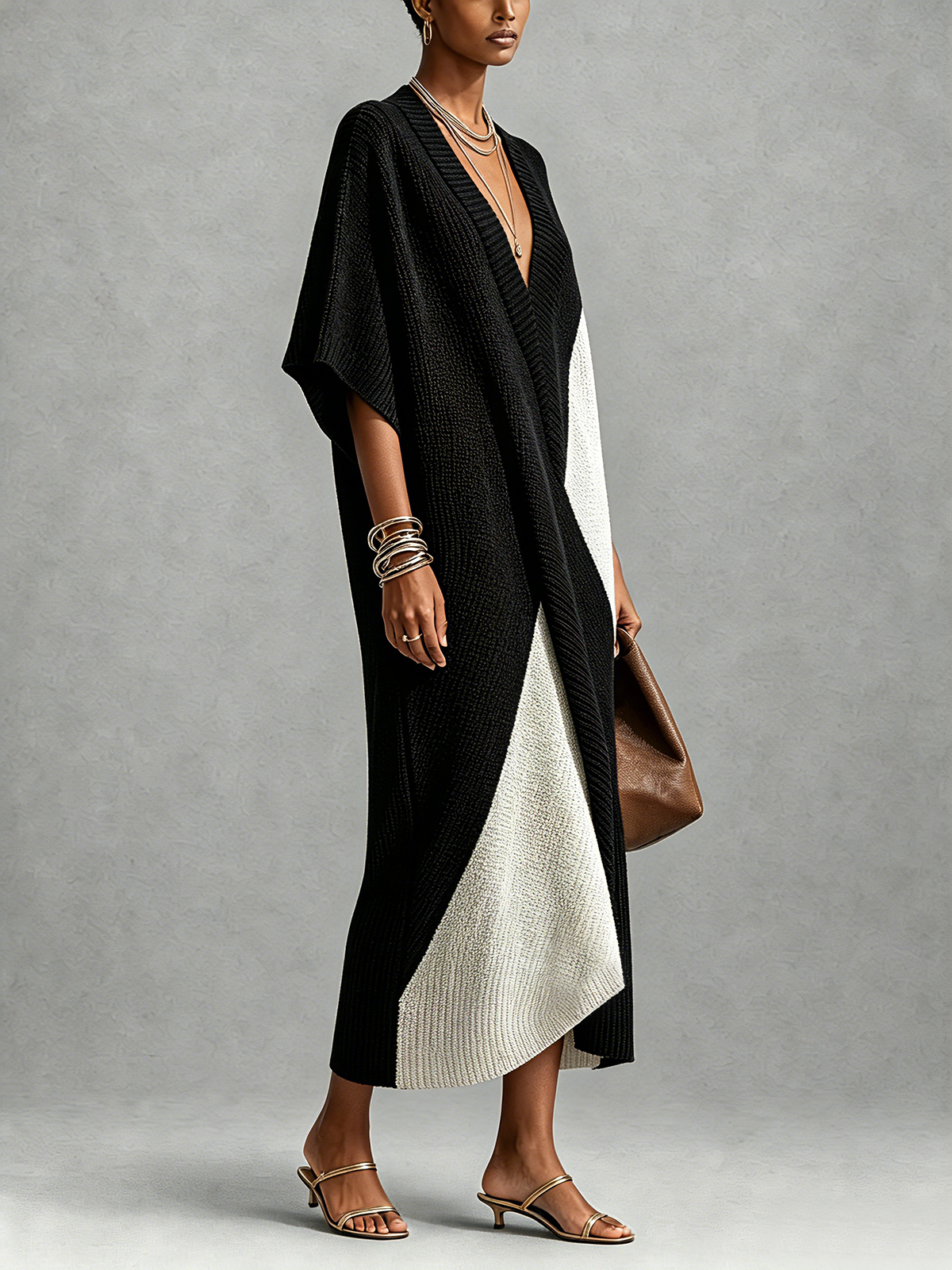 Véra two-tone knit midi dress in black and ivory, side view