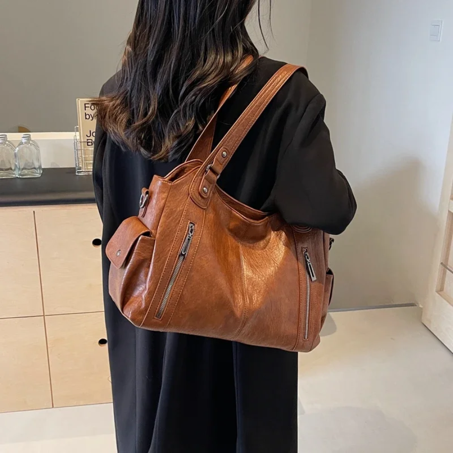 Casual shoulder bag in cognac, worn on the shoulder, back view