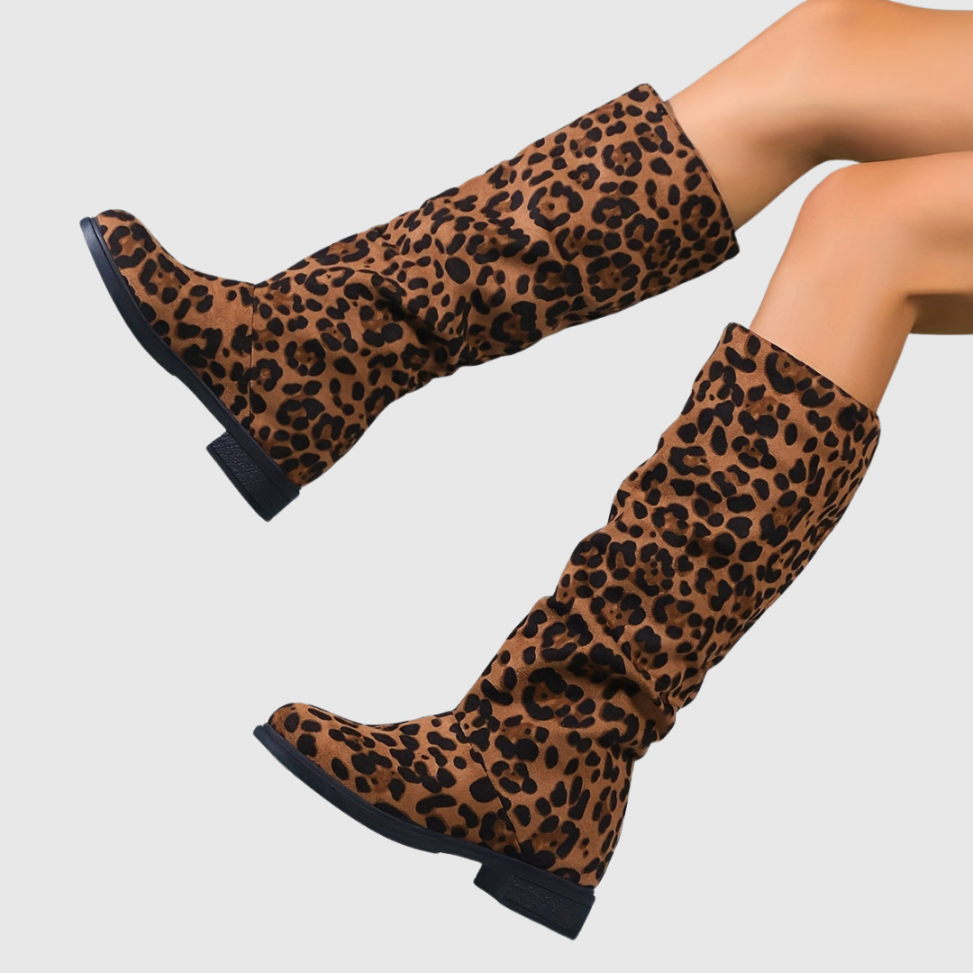 Selah leopard mid-calf boots in natural leopard print, side view on model