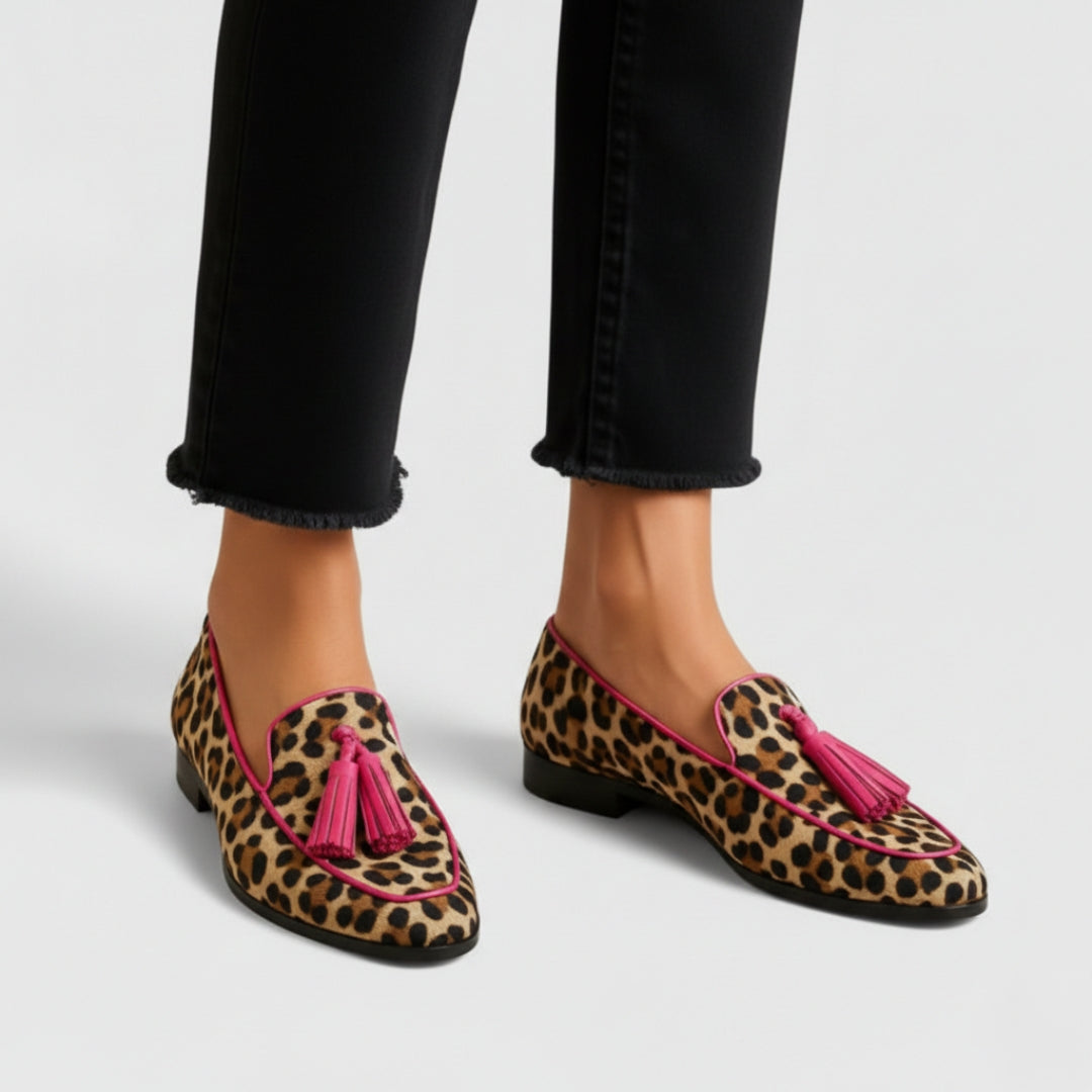 Elizabeth leopard print tassel loafers in leopard, side view on model