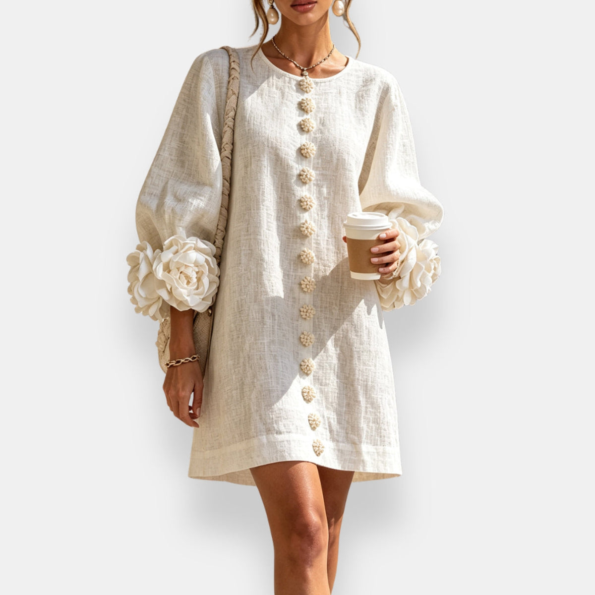 Cecily sculpted floral button dress in cream white, styled with a shoulder bag