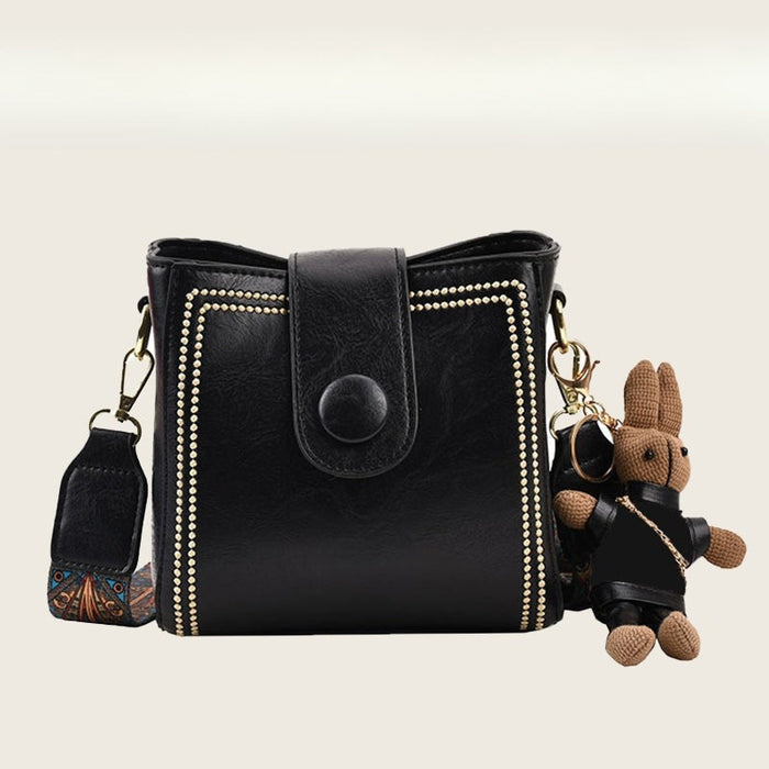 Ethel vintage shoulder bag in black with gold stud trim and rabbit charm