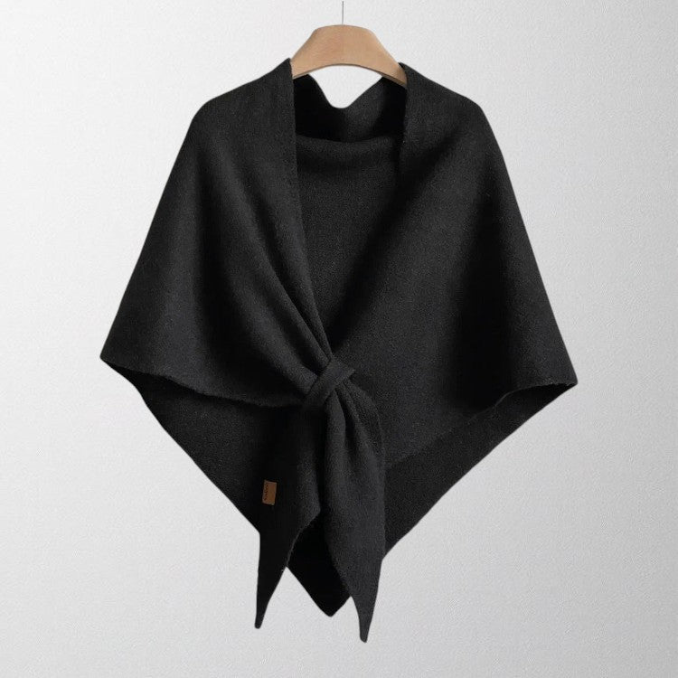Averil knit shoulder scarf in black, front-tie view on a hanger