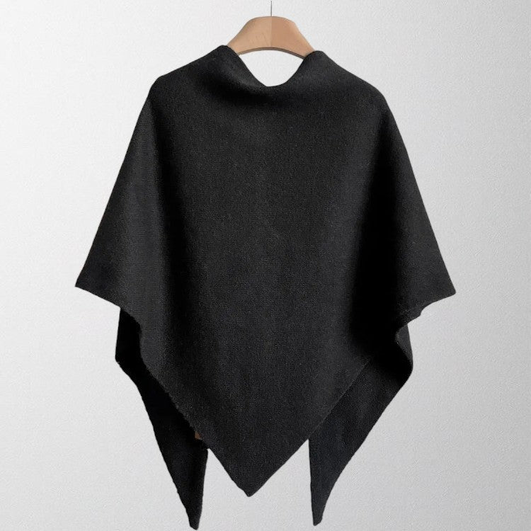 Averil knit shoulder scarf in black, back view on a hanger