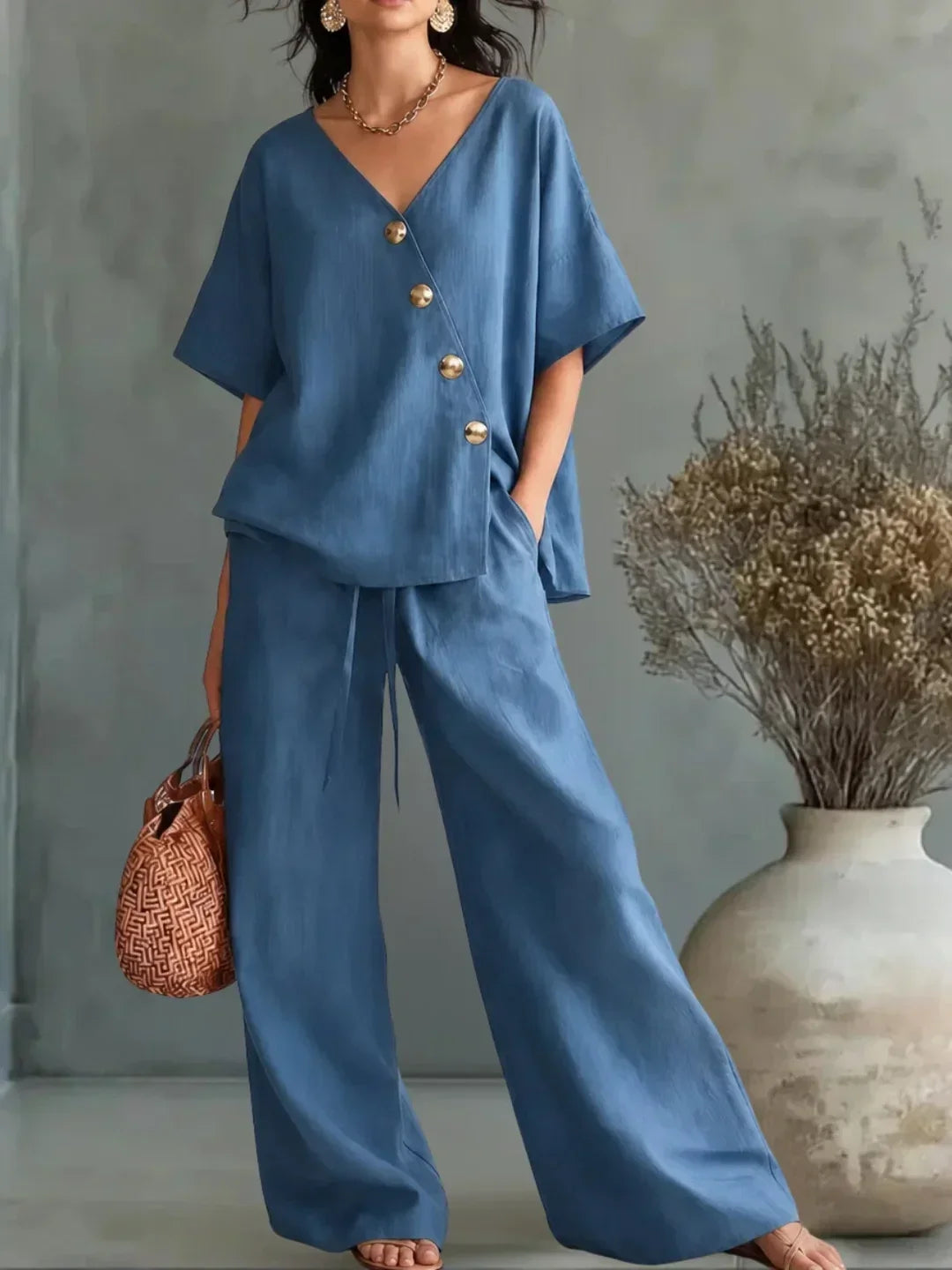 Celia V-neck button set in blue, full-length front view