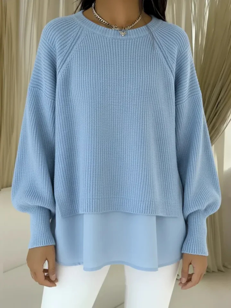 Casilda two-layer effect jumper in light blue, front view with flowing hem