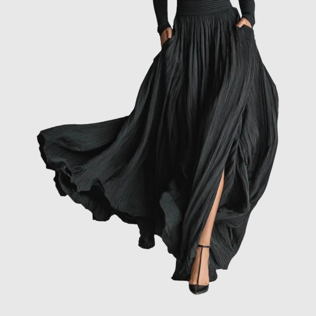 Cerynn pleated maxi skirt in black, detail of flowing hem and slit