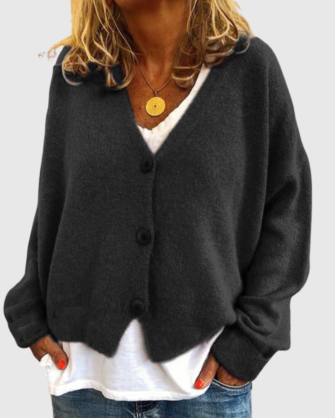 Evelora knit cardigan in black, front view worn open over a white tee